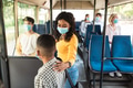 Black lady wearing protective mask talking to son in autobus Black lady wearing protective mask talking to son in autobus - PhotoDune Item for Sale