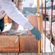 Bricklayer industrial worker installing brick masonry Bricklayer industrial worker installing brick masonry - PhotoDune Item for Sale