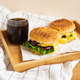 Large and tasty grilled hamburgers with sesame seeds lie on a wooden tray with a glass of cola Large and tasty grilled hamburgers with sesame seeds lie on a wooden tray with a glass of cola - PhotoDune Item for Sale
