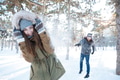 Beautiful happy couple throwing snowballs and having fun Beautiful happy couple throwing snowballs and having fun - PhotoDune Item for Sale