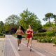 Two Energetic Young Women Running in the Park Two Energetic Young Women Running in the Park - PhotoDune Item for Sale