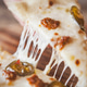 Grabbing a cheesy slice of pizza. Grabbing a cheesy slice of pizza. - PhotoDune Item for Sale