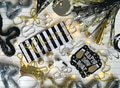 Festive gold & black Happy New Year flat lay with party supplies to celebrate & receive the new year Festive gold & black Happy New Year flat lay with party supplies to celebrate & receive the new year - PhotoDune Item for Sale