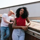 Serious diverse couple standing on stairs outside Serious diverse couple standing on stairs outside - PhotoDune Item for Sale