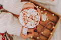 Close up of women's hands holding white mug with hot cocoa, tea or coffee and marshmallow. Close up of women's hands holding white mug with hot cocoa, tea or coffee and marshmallow. - PhotoDune Item for Sale