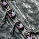Overhead view of female crew racers rowing in an octuple racing shell ...