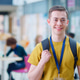 Portrait Of Smiling Male College Student In Busy Communal Campus Building Portrait Of Smiling Male College Student In Busy Communal Campus Building - PhotoDune Item for Sale