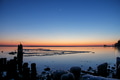 Beach sunset landscape reflecting the horizon blue and orange colors in the frozen water Beach sunset landscape reflecting the horizon blue and orange colors in the frozen water - PhotoDune Item for Sale
