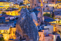 Goreme, Cappadocia, Turkey. View of the evening city from the mountain. Bright evening city. Goreme, Cappadocia, Turkey. View of the evening city from the mountain. Bright evening city. - PhotoDune Item for Sale