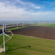 Aerial View of Wind Turbines in Green Field for Renewable Energy Aerial View of Wind Turbines in Green Field for Renewable Energy - PhotoDune Item for Sale