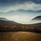 foggy landscape with forest and mountain in the background foggy landscape with forest and mountain in the background - PhotoDune Item for Sale