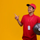 Asian Delivery Courier in Red Uniform Pointing at Copy Space while Carrying Water Gallon Asian Delivery Courier in Red Uniform Pointing at Copy Space while Carrying Water Gallon - PhotoDune Item for Sale