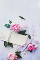 Minimal styled flat lay with peony flowers, petals and blank notebook on a white background Minimal styled flat lay with peony flowers, petals and blank notebook on a white background - PhotoDune Item for Sale