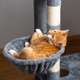 Ginger domestic playful cat lying on cat tower. Pet house bed, tree with scratching posts. Ginger domestic playful cat lying on cat tower. Pet house bed, tree with scratching posts. - PhotoDune Item for Sale