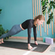 woman practicing yoga online on mat standing in plank position woman practicing yoga online on mat standing in plank position - PhotoDune Item for Sale
