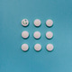 White pills on a blue background White pills on a blue background - PhotoDune Item for Sale