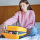 Woman packing yellow suitcase on bed for travel Woman packing yellow suitcase on bed for travel - PhotoDune Item for Sale