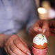 Close-up of hands preparing a decorated egg in a pink egg cup Close-up of hands preparing a decorated egg in a pink egg cup - PhotoDune Item for Sale
