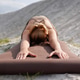 Relaxed yoga woman stretching forward in child’s pose near lake Relaxed yoga woman stretching forward in child’s pose near lake - PhotoDune Item for Sale