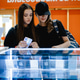 female friends stand at the shop window and choose a smartphone female friends stand at the shop window and choose a smartphone - PhotoDune Item for Sale