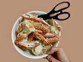 Hand holding a bowl of crabs and crab cracker Hand holding a bowl of crabs and crab cracker - PhotoDune Item for Sale