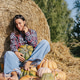 Pumpkin harvest. Portrait woman farmer picking autumn crop of vegetables on farm. Pumpkin harvest. Portrait woman farmer picking autumn crop of vegetables on farm. - PhotoDune Item for Sale