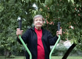 Smiling elderly woman is doing exercises on simulator, trainer ellipse outdoors in the yard Smiling elderly woman is doing exercises on simulator, trainer ellipse outdoors in the yard - PhotoDune Item for Sale