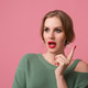 young attractive woman in green sweater, pink background young attractive woman in green sweater, pink background - PhotoDune Item for Sale