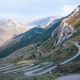 Two off-road vehicles driving on a winding mountain serpentine road Two off-road vehicles driving on a winding mountain serpentine road - PhotoDune Item for Sale