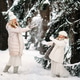 Handsome mother and daughter are having fun outdoor in winter time. Playing with snow in forest Handsome mother and daughter are having fun outdoor in winter time. Playing with snow in forest - PhotoDune Item for Sale