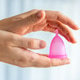 Reusable Menstrual Cup in Female Hands Reusable Menstrual Cup in Female Hands - PhotoDune Item for Sale