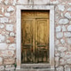 Rustic wooden door on old stone house Rustic wooden door on old stone house - PhotoDune Item for Sale