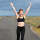 Happy woman with arms raised outside Happy woman with arms raised outside - PhotoDune Item for Sale