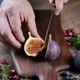 Fresh fruit figs close-up. Concept of weight loss, sports and healthy eating. Men's hands Fresh fruit figs close-up. Concept of weight loss, sports and healthy eating. Men's hands - PhotoDune Item for Sale