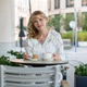 Woman Enjoying Dessert and Coffee at Outdoor Cafe Table in Urban Setting Woman Enjoying Dessert and Coffee at Outdoor Cafe Table in Urban Setting - PhotoDune Item for Sale