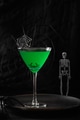 Halloween green cocktail decorated cobweb. Vertical format. Halloween green cocktail decorated cobweb. Vertical format. - PhotoDune Item for Sale
