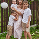 beautiful young mother in a summer dress and three sons, of different ages, an adult and a one-year beautiful young mother in a summer dress and three sons, of different ages, an adult and a one-year - PhotoDune Item for Sale