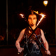 Fire performer holding flaming swords at night Fire performer holding flaming swords at night - PhotoDune Item for Sale