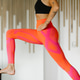 Close up of a fit tattooed woman doing yoga in pink high waist leggings Close up of a fit tattooed woman doing yoga in pink high waist leggings - PhotoDune Item for Sale