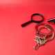 Top view handgun,magnifying glass and handcuff on a red background Top view handgun,magnifying glass and handcuff on a red background - PhotoDune Item for Sale
