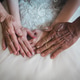 Parents holding bride hands during a wedding ceremony Parents holding bride hands during a wedding ceremony - PhotoDune Item for Sale