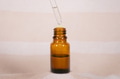 Open amber bottle with dropper pipette with serum or essential oil. Open amber bottle with dropper pipette with serum or essential oil. - PhotoDune Item for Sale