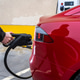 Hand Plugging Electric Car at Charging Station Hand Plugging Electric Car at Charging Station - PhotoDune Item for Sale