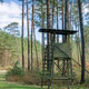 A wooden observation or hunting tower in the forest A wooden observation or hunting tower in the forest - PhotoDune Item for Sale