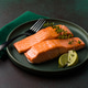Cooked salmon fllets on green background Cooked salmon fllets on green background - PhotoDune Item for Sale