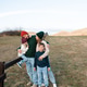 Happy family of mother, dad and children wearing knitted clothes in farmland. Happy family of mother, dad and children wearing knitted clothes in farmland. - PhotoDune Item for Sale