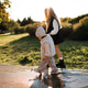 Happy kid girls holding hands walking in autumn park over sun light Happy kid girls holding hands walking in autumn park over sun light - PhotoDune Item for Sale