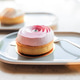 Delicious berry mousse tart shaped like a rose on a modern ceramic plate with a dessert fork, select Delicious berry mousse tart shaped like a rose on a modern ceramic plate with a dessert fork, select - PhotoDune Item for Sale