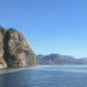 Majestic steep mountains and rocky cliffs rising over the calm waters of Lysefjord on a sunny day, N Majestic steep mountains and rocky cliffs rising over the calm waters of Lysefjord on a sunny day, N - PhotoDune Item for Sale