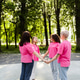Women wearing pink ribbons joining hands in support Women wearing pink ribbons joining hands in support - PhotoDune Item for Sale